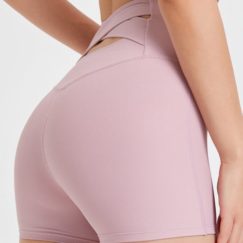 Lichtroze yoga shorts met gekruiste tailleband op de rug